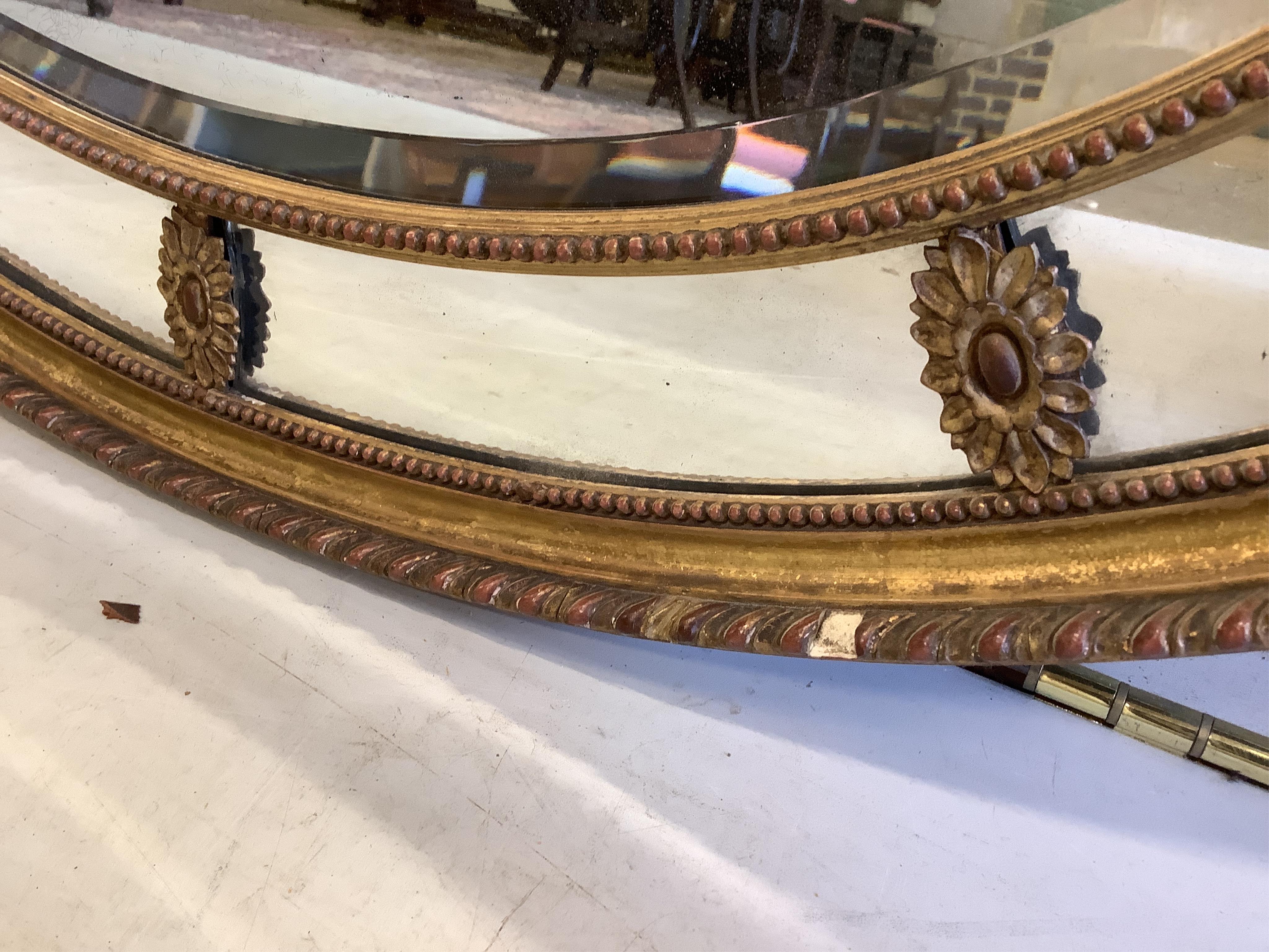 A Victorian Adam style oval giltwood and composition wall mirror with marginal plate, width 81cm, height 57cm